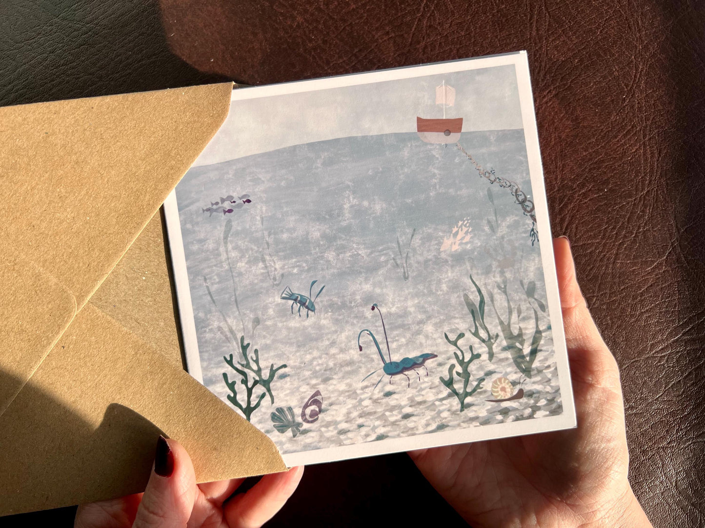 Blank Seaside Greeting Card – Blue Lobster & Prawn Illustration with Boat and Pebbles – Coastal Art Card for Any Occasion