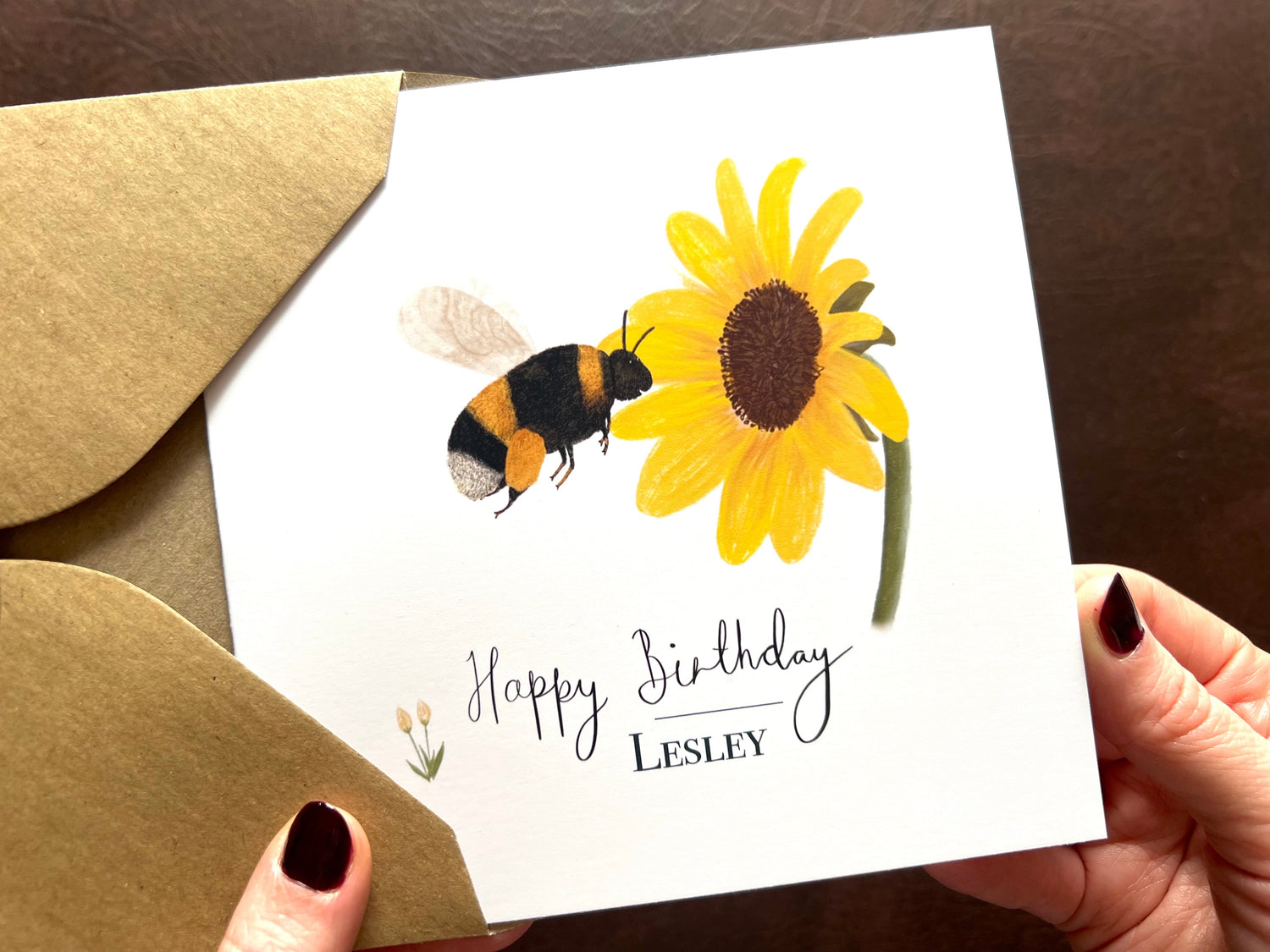 Personalised birthday card with name, illustrated bee and sunflower design, handwritten Happy Birthday text