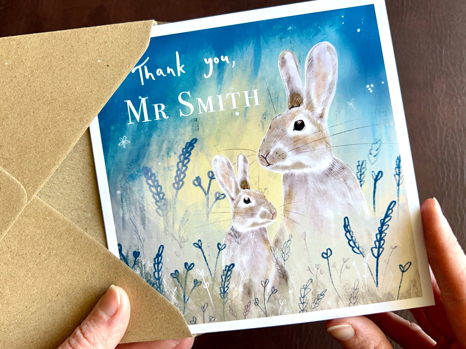 Personalised thank you teacher card with illustrated rabbits under a celestial starry night sky and custom name text