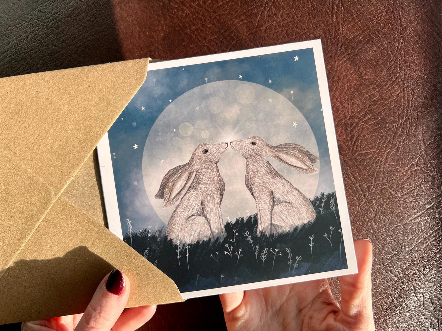Moongazing Hares Greeting Card – Mystical Moonlight Illustration (Blank Inside)