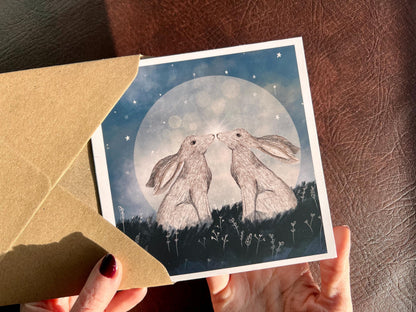 Moongazing Hares Greeting Card – Mystical Moonlight Illustration (Blank Inside)