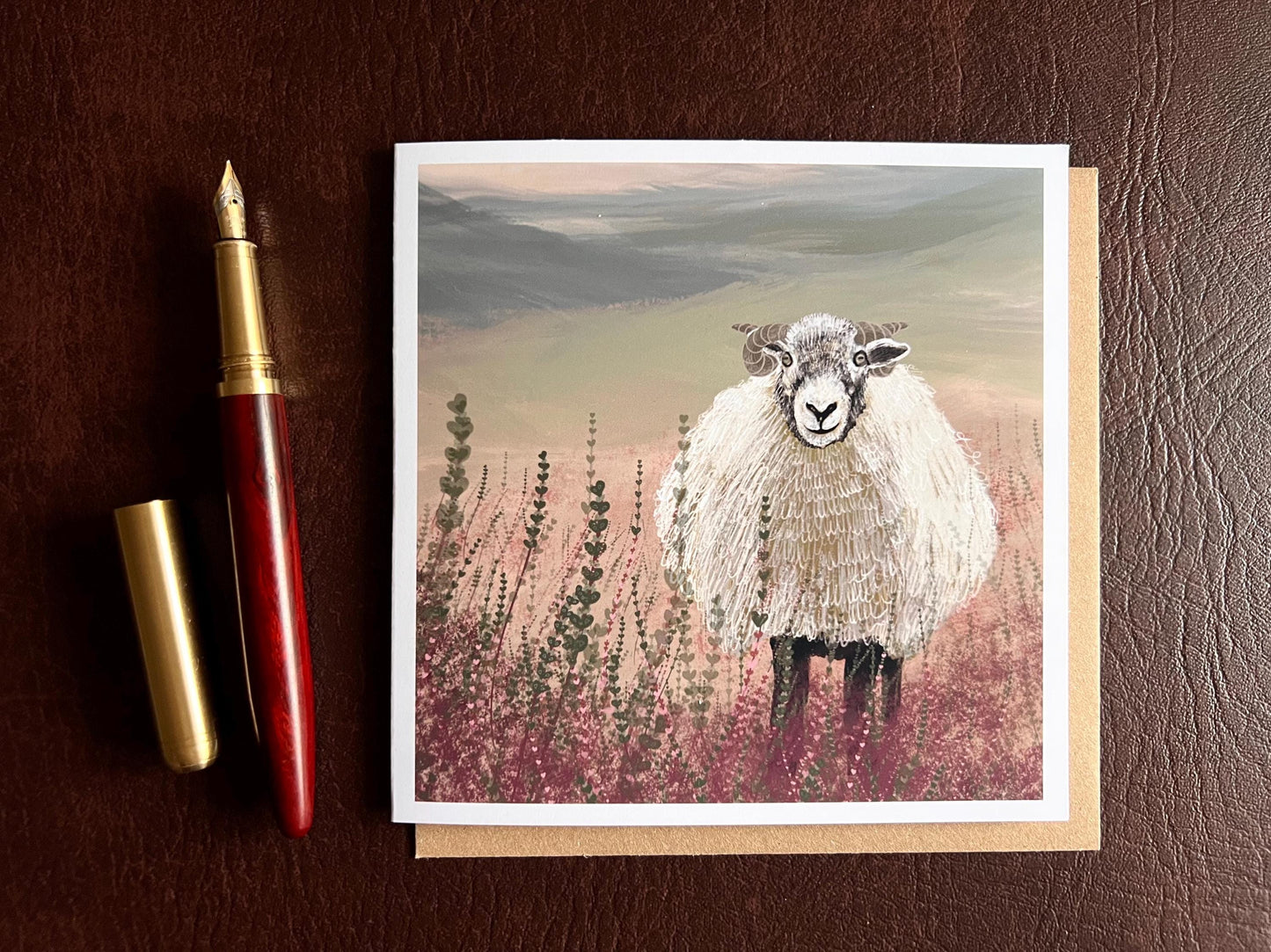 Artisan illustrated art greeting card featuring a Swaledale sheep standing in a heather landscape on the Yorkshire moors, laid flat for display. Versatile countryside wildlife design with no text on the front, suitable for all occasions.