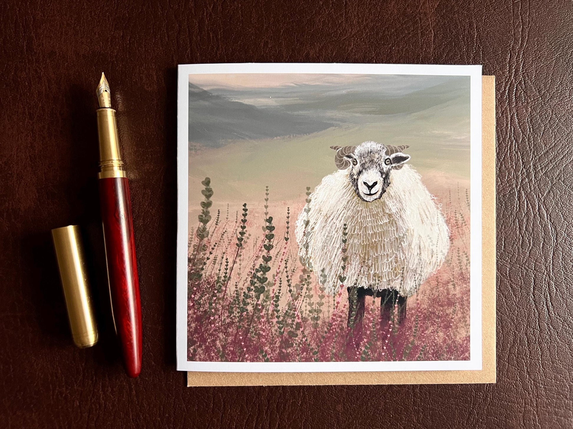 Artisan illustrated art greeting card featuring a Swaledale sheep standing in a heather landscape on the Yorkshire moors, laid flat for display. Versatile countryside wildlife design with no text on the front, suitable for all occasions.