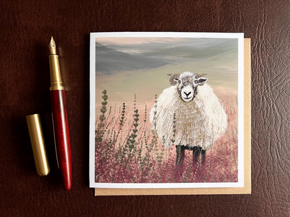 Artisan illustrated art greeting card featuring a Swaledale sheep standing in a heather landscape on the Yorkshire moors, laid flat for display. Versatile countryside wildlife design with no text on the front, suitable for all occasions.