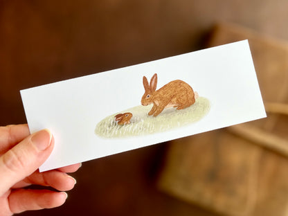 Cute baby bunny bookmark by artist Hayley Victoria. Rabbit and baby rabbit design. Picture book illustration style. 