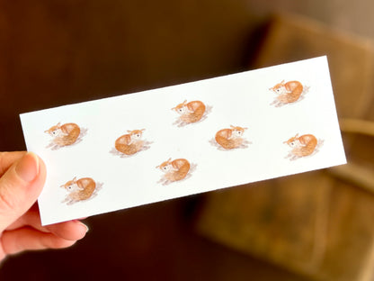 Illustrative fox bookmark. 8 happy foxes against a plain white background. Lovely reading gift for friend or family member. Handcrafted bookmark by artist and owner of a small independent business  in the UK. 