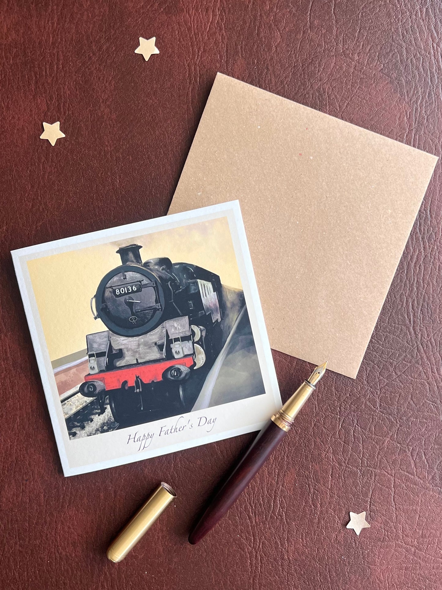 Illustrated North Yorkshire Moors Railway card featuring steam locomotive 80136, photographed flat with its accompanying kraft envelope. Ideal for Father’s Day and special family occasions.