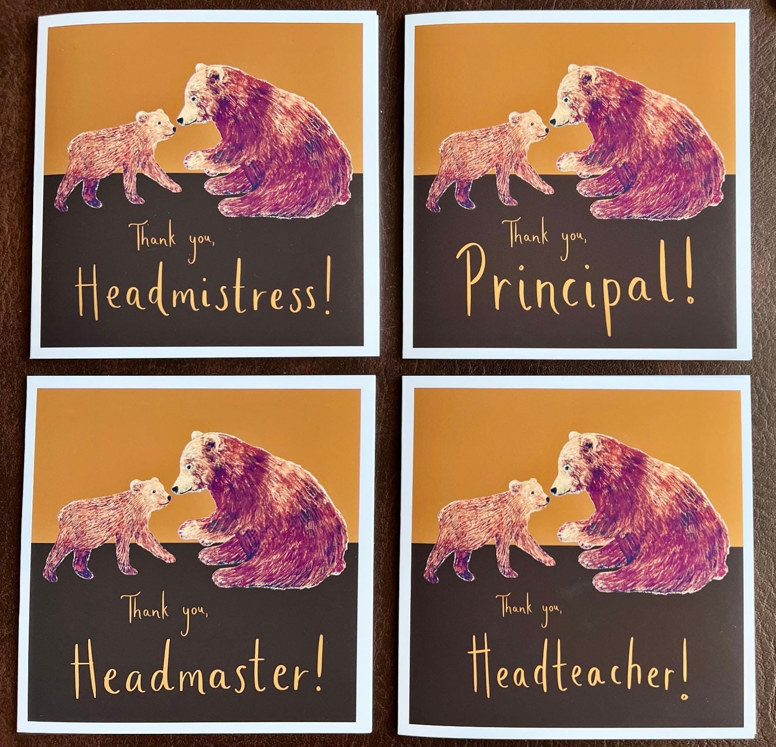 Artisan infographic image showing four personalised thank you card examples laid flat on a brown leatherette background. Each card features a brown bear and bear cub illustration with alternative wording options including ‘Thank you, Headmistress!’, ‘Thank you, Principal!’, ‘Thank you, Headmaster!’ and ‘Thank you, Headteacher!’. Ideal as an end of term thank you card for school leaders, a school staff appreciation card, or a personalised thank you gift for a headteacher, principal or senior member of staff.