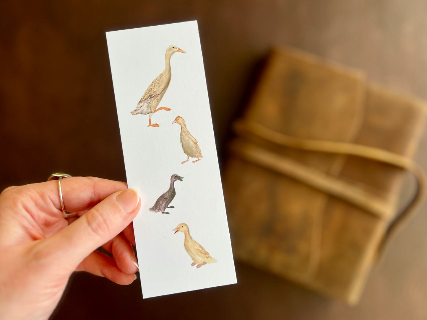 White bookmark featuring a runner ducks illustration by artist Hayley Victoria. Artisan. Bookmark handcrafted in East Yorkshire. 
