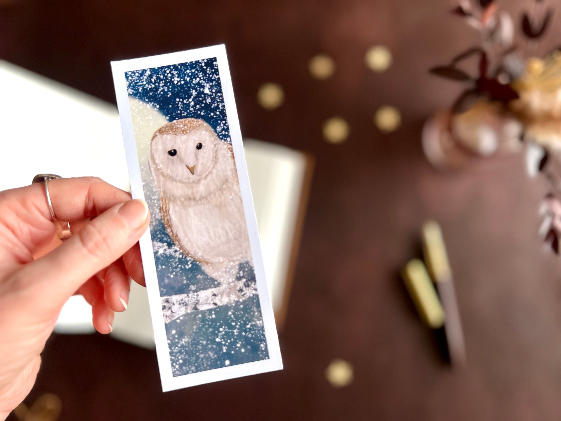 Owl bookmark displayed in front of a mature inspired desk scene. Artist made stocking filler gift from East Yorkshire artist. Independent small business product. 