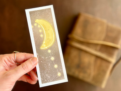 Moon and stars illustration printed by the artist as an artisan bookmark with white border. Cute illustration to be used as reading gift. 