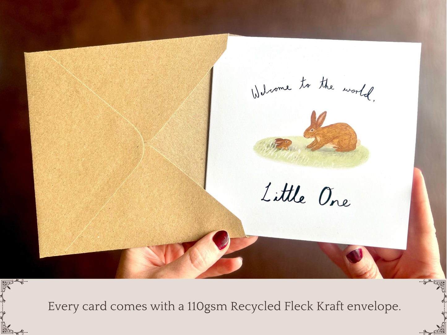 Infographic showing an artisan new baby card with a rabbit storybook illustration being removed from a kraft envelope, with text underneath explaining that every card comes with a 110gsm recycled fleck kraft envelope.