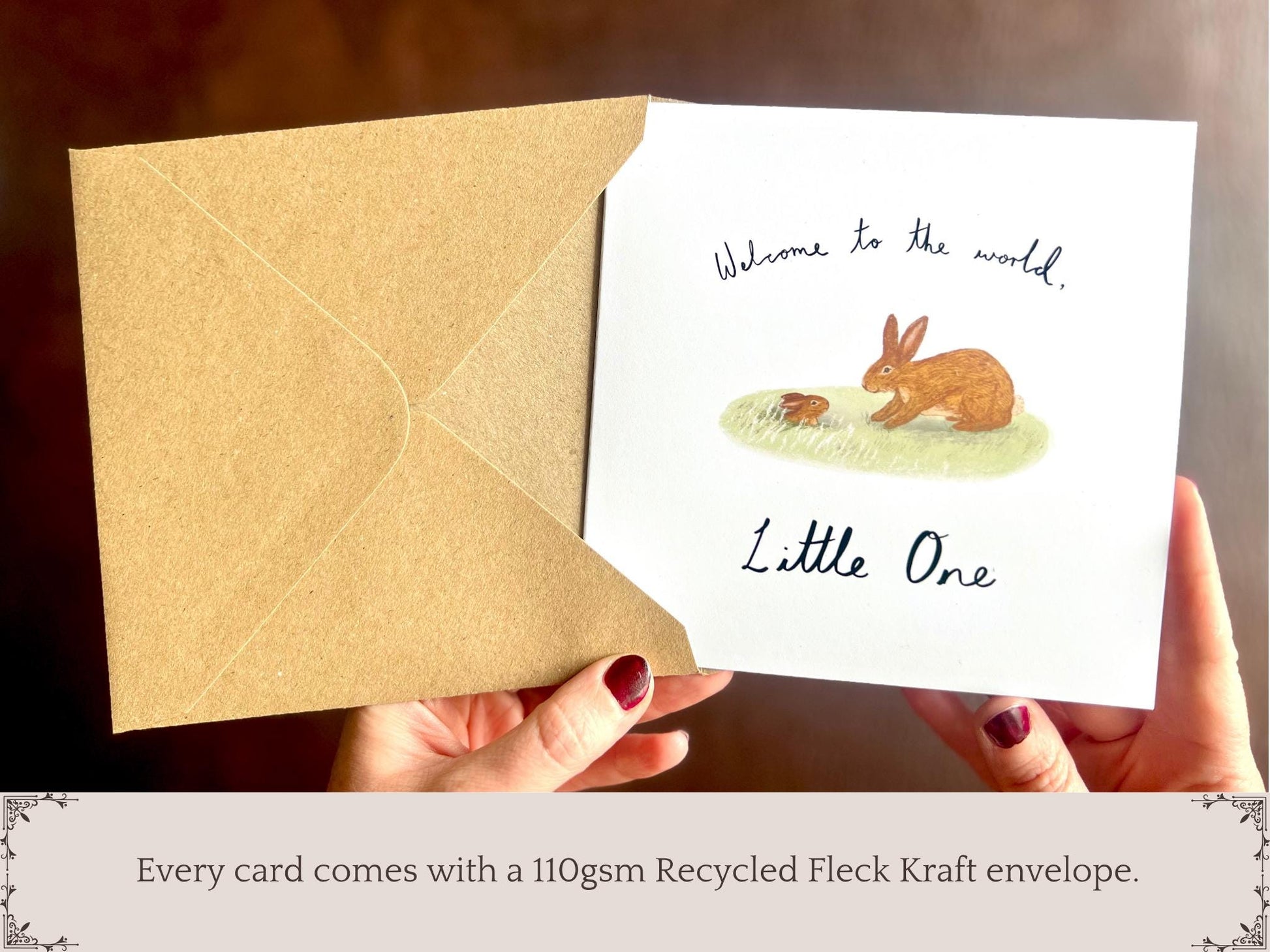 Infographic showing an artisan new baby card with a rabbit storybook illustration being removed from a kraft envelope, with text underneath explaining that every card comes with a 110gsm recycled fleck kraft envelope.