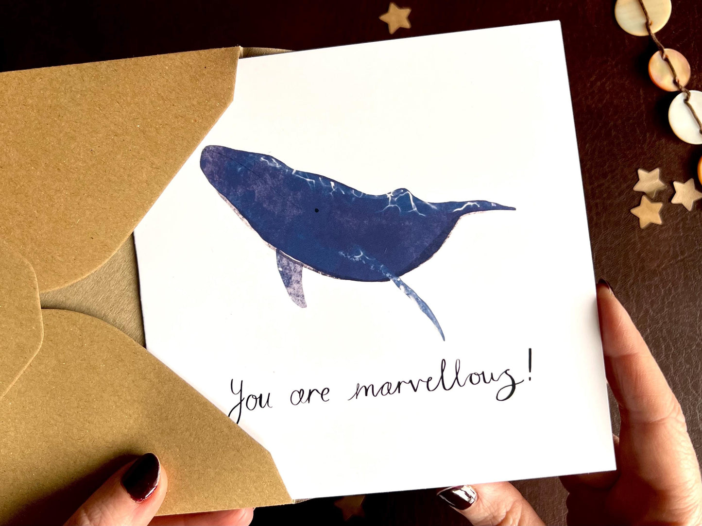 Artisan greeting card featuring a blue whale illustration on a plain white background, shown without personalisation. The card reads handwritten style text 'You are marvellous!' and is designed for congratulations, good luck or positive wellbeing.
