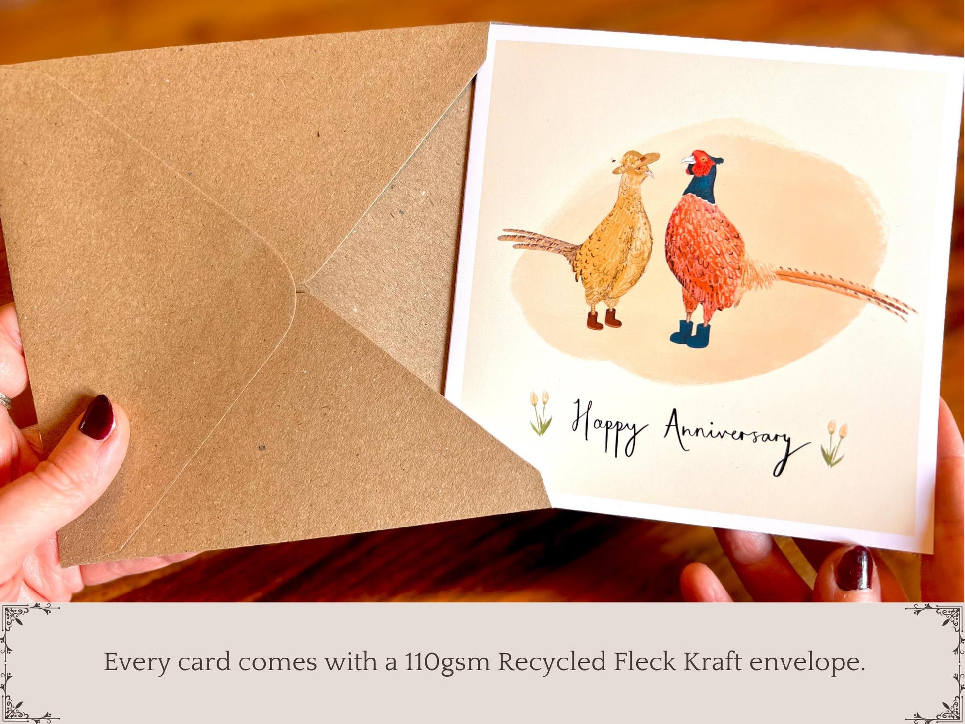 Infographic showing a greeting card being removed from a recycled fleck kraft envelope. Text underneath states “Every card comes with a 110gsm recycled fleck kraft envelope”. Premium illustrated greeting card packaging detail.