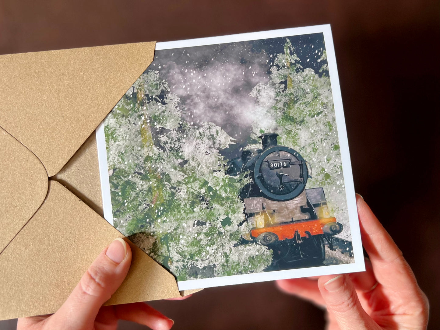 Special illustrated Christmas greeting card featuring steam engine 80136 travelling through a snow-covered forest at night, with frosted trees and steam rising into the night sky. Festive railway-themed winter scene card for train enthusiasts.