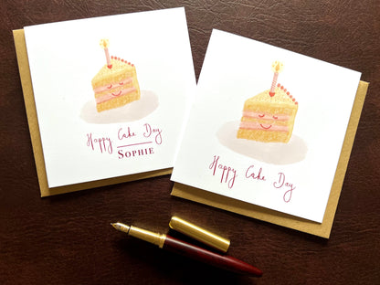 Two Happy Cake Day birthday cards side by side, one personalised with a name and one without, smiling cake illustration with lemon yellow icing and pink candle, UK handmade