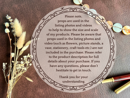 Infographic on a brown leatherette background explaining that props such as vases, flowers, sketchbooks, paper stars, and pens shown in product images are for display only and not included. Part of a 16 pack animal bookmark set for wedding favours.